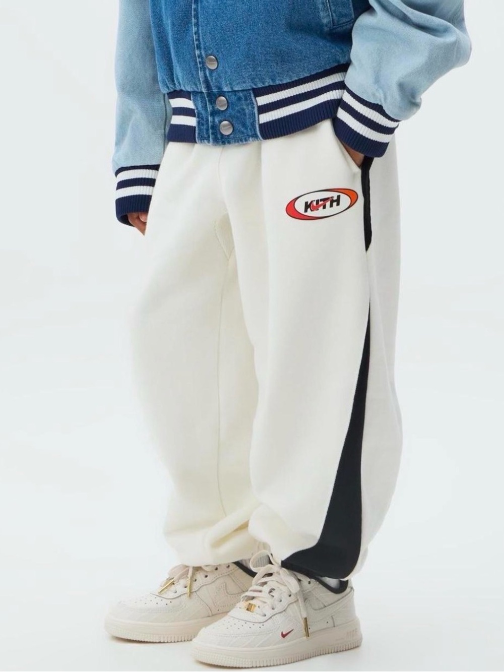 Kith Kids Cream Sweatpants with Black Side Stripe and Orange Logo